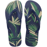 A pair of men's Havaianas flip flops with a tropical leaf print in green and white.