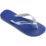 Kids' cobalt blue flip flop with white straps and Brazil flag detail, right 3/4 view