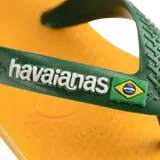 yellow flip flops with green heel straps featuring a brazil flag,zooming in on strap and white havaianas written on the strap with a brazil flag next to it